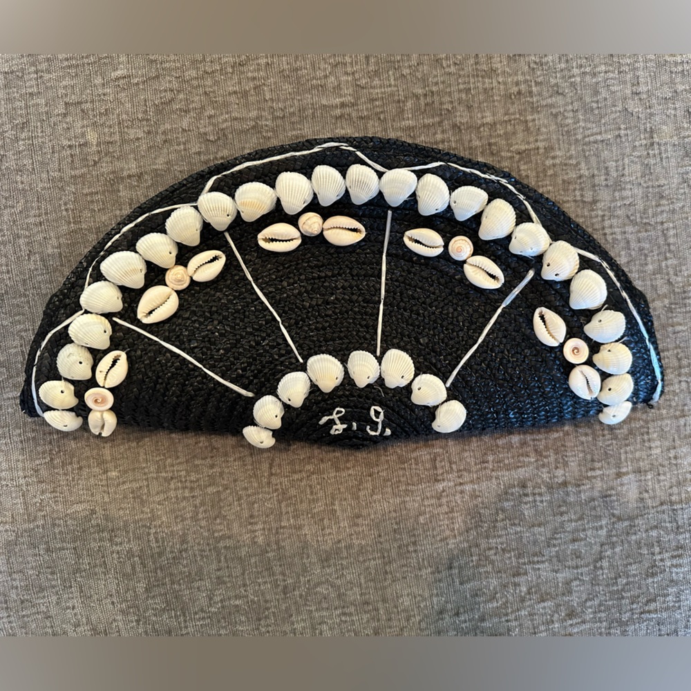 LuLu Guinness clutch. Black raffia. Not missing any shells. No rips.